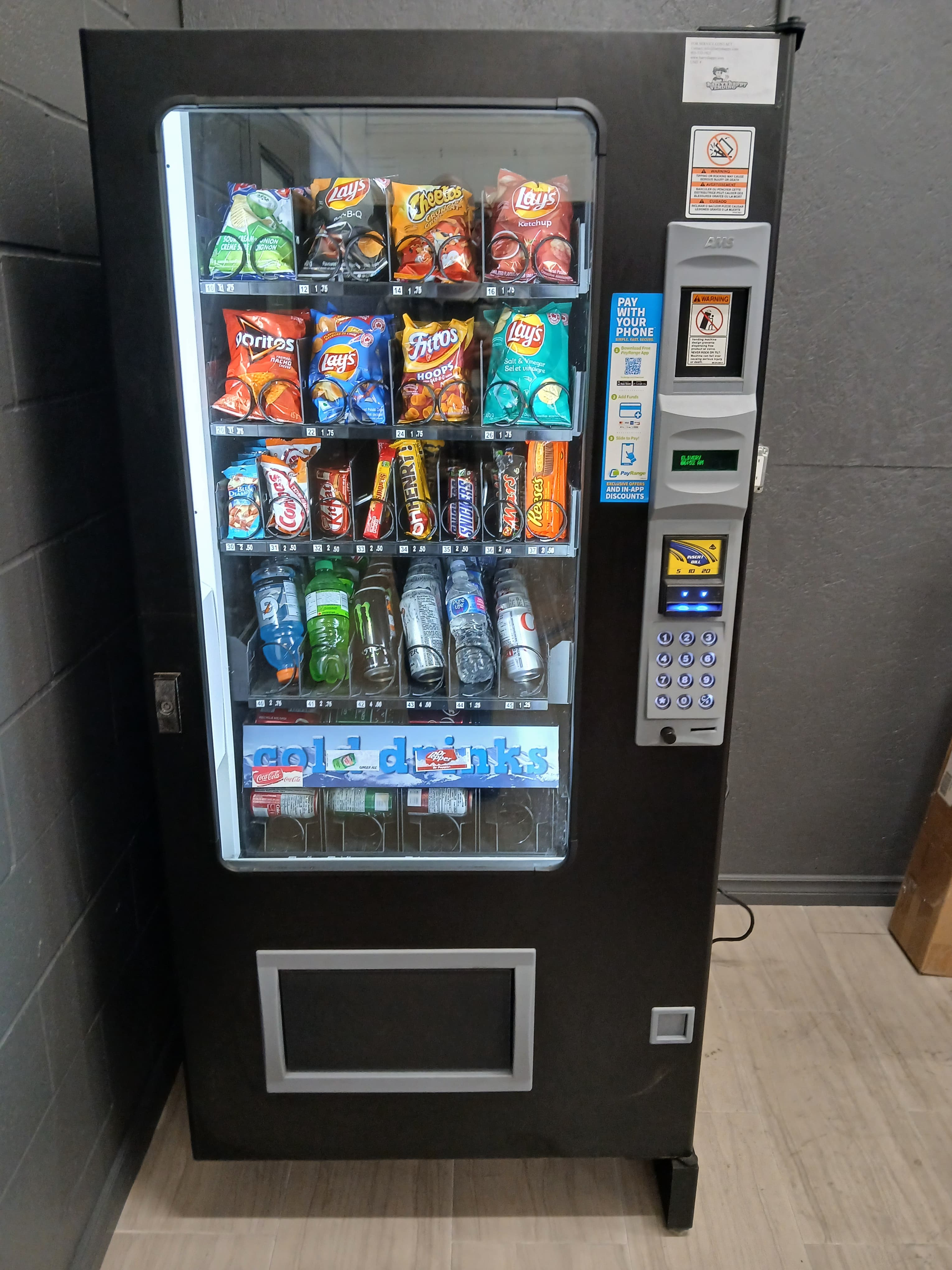Combination snack and cold drink vending machine serviced by Harry's Happy Vending