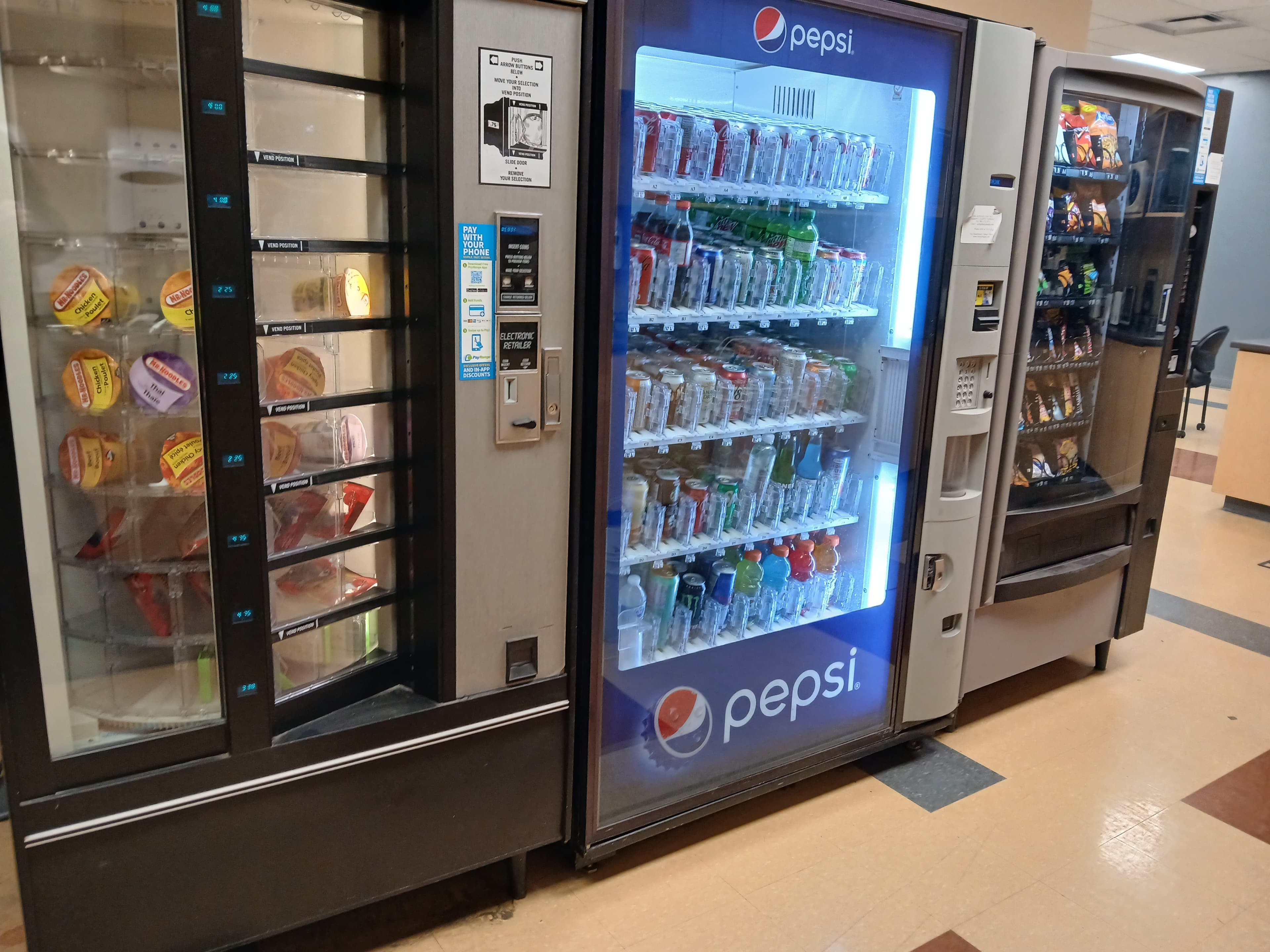 Frozen meal, Pepsi beverage, and snack vending machines installed together in a Harry's Happy Vending client facility